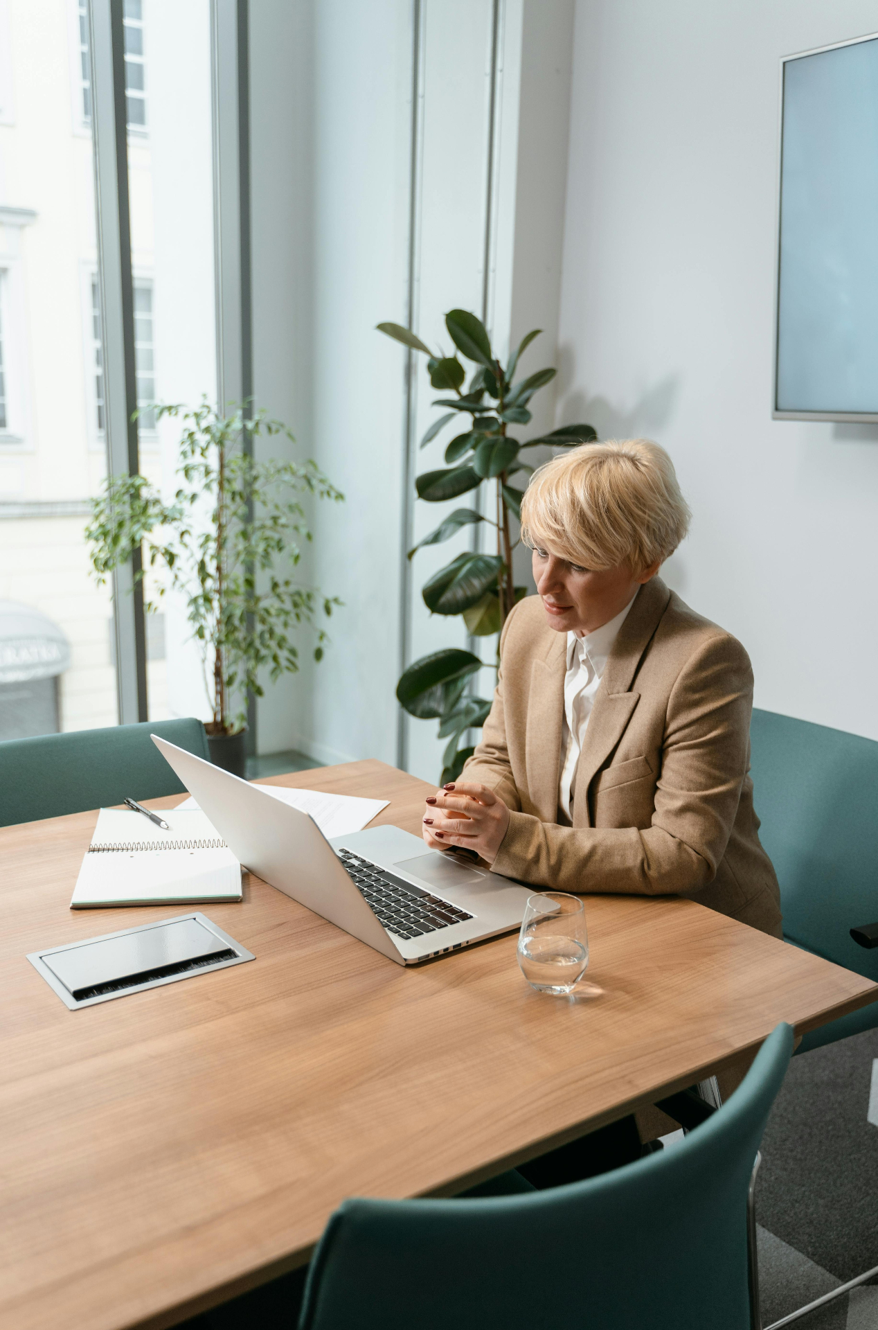 Professional working on a laptop at a clean desk